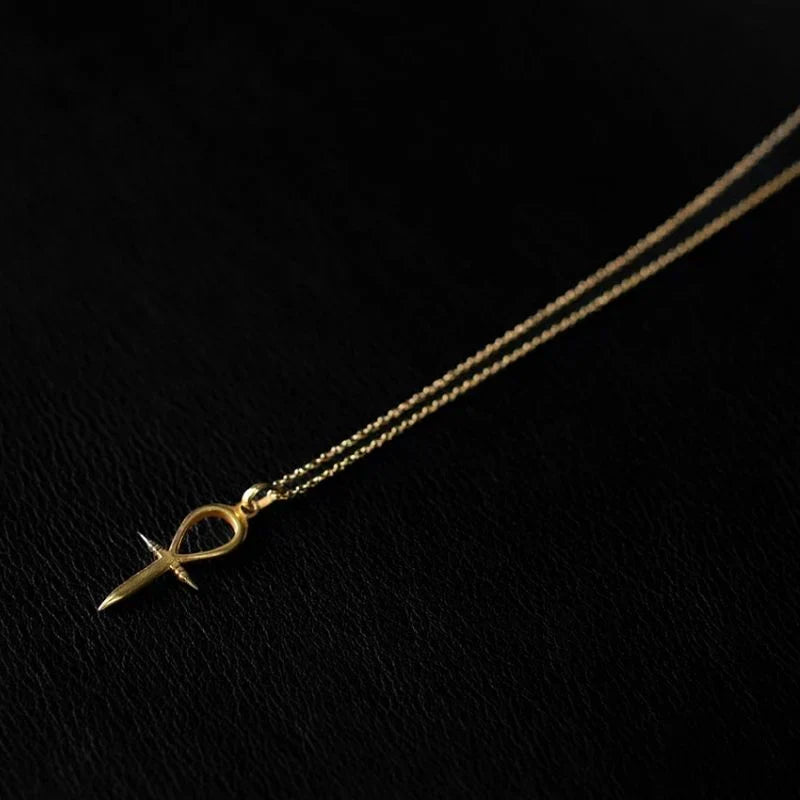 22K gold plated ankh pendant necklace on a 925 sterling silver base, showing the warm gold tone against bare skin.
