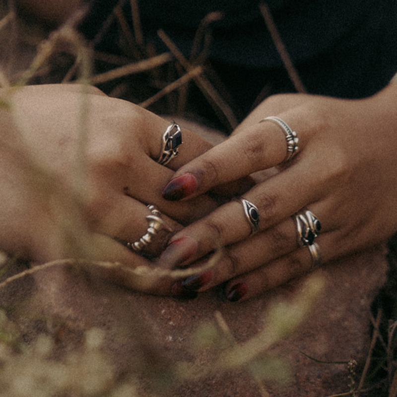Organic twisted gothic ring band in 925 sterling silver with a black onyx centre stone and sculptural root-like structure.