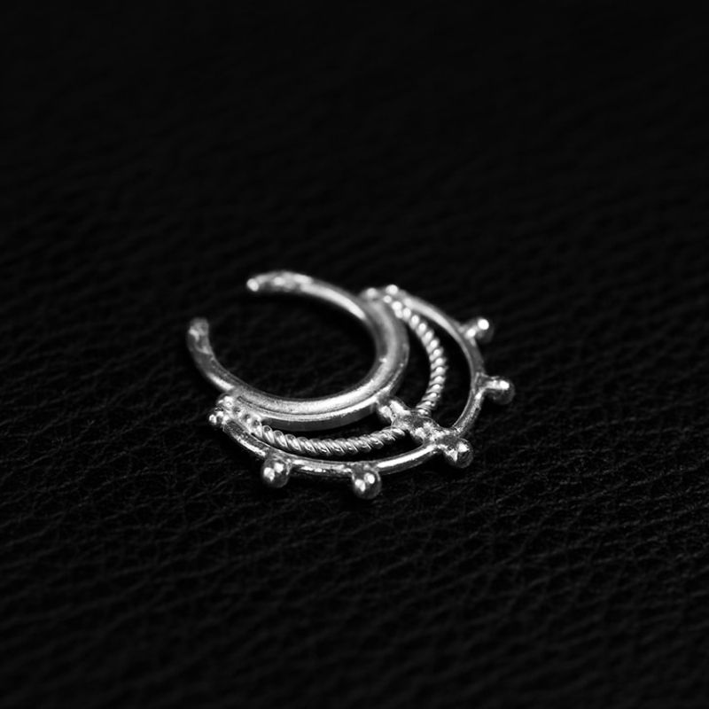 925 sterling silver clip-on septum ring with three rows of small beads along a rounded open hoop, no fitting pin.